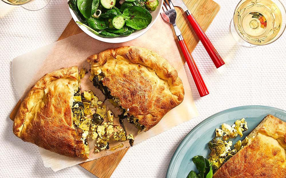 Greek-style Spanakopita Calzones with feta, spinach and artichokes,