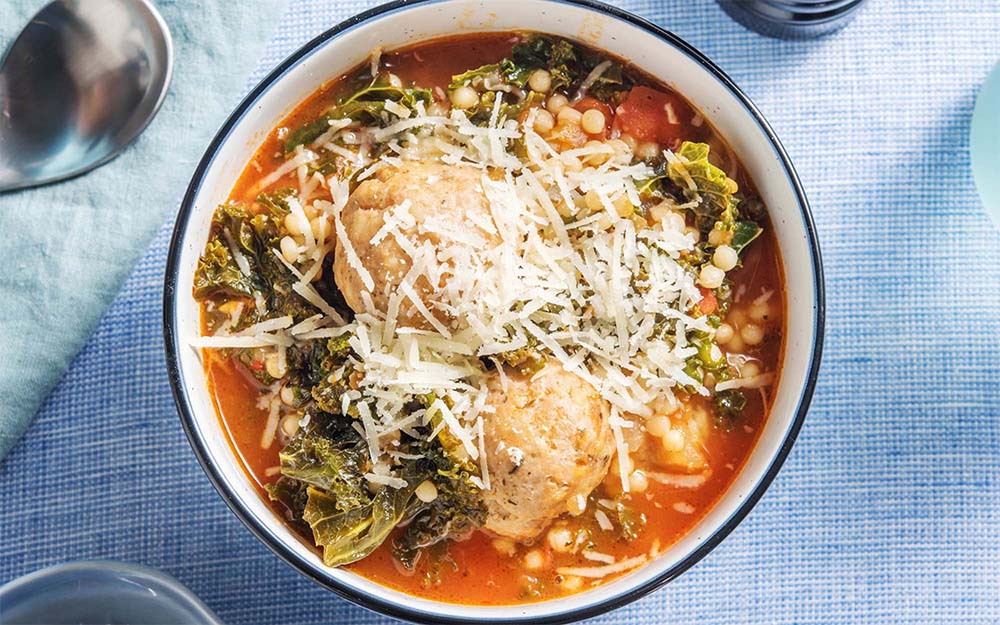 One Pot Italian Turkey Meatball Soup with pearl couscous and parmesan cheese,