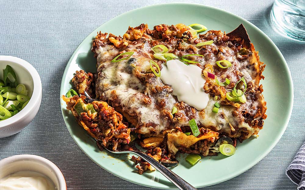 Tex-Mex Beef Lasagna with poblano peppers and a cheesy crust,
