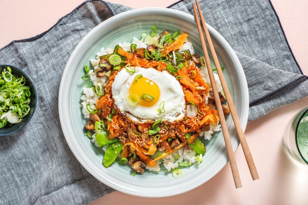 Mushroom Bibimbap Bowl with sticky rice and gochujang drizzle