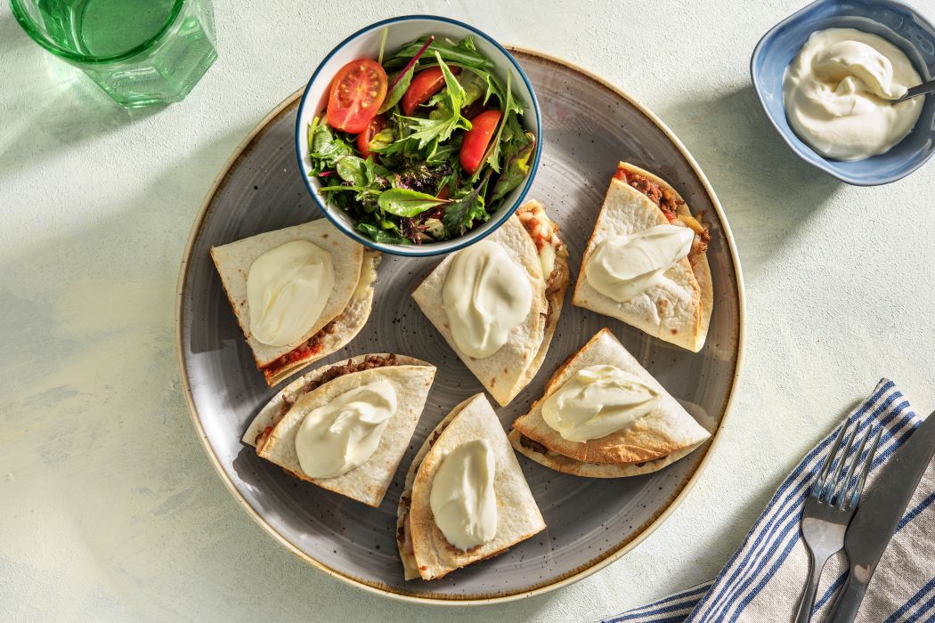 Cheesy Beef Quesadillas with sour cream, salsa and a green salad