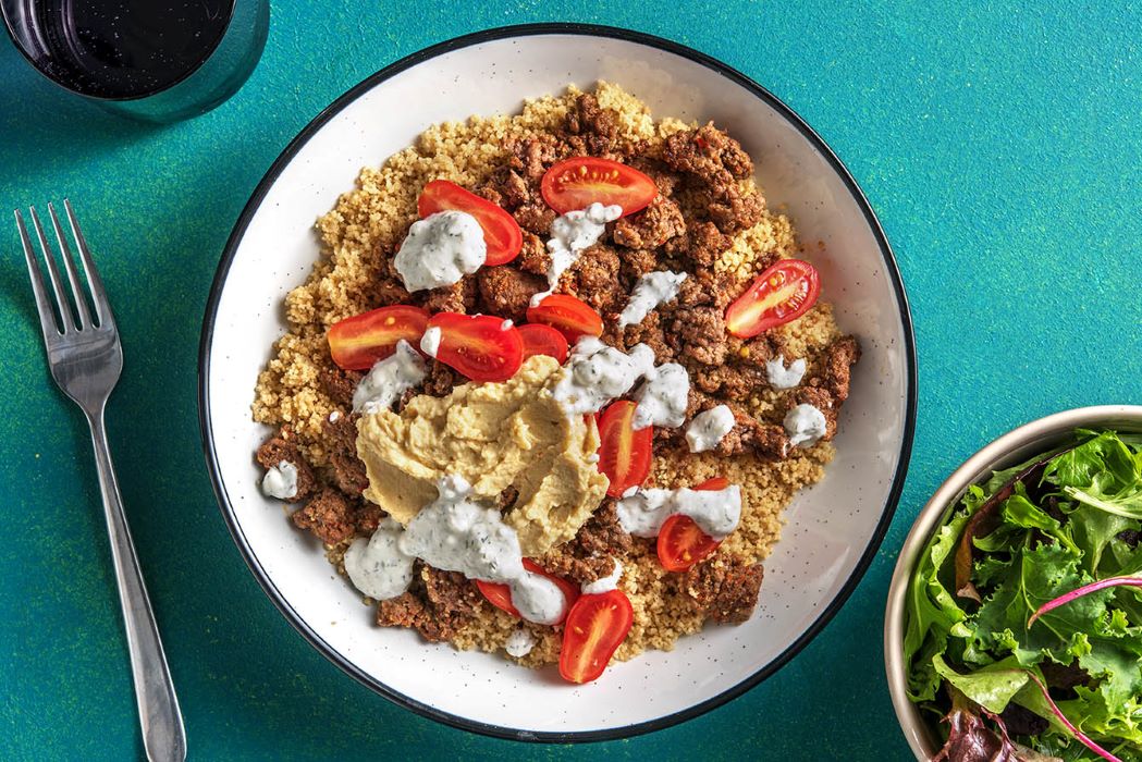 Middle Eastern Beef Bowl with couscous and creamy hummus dressing