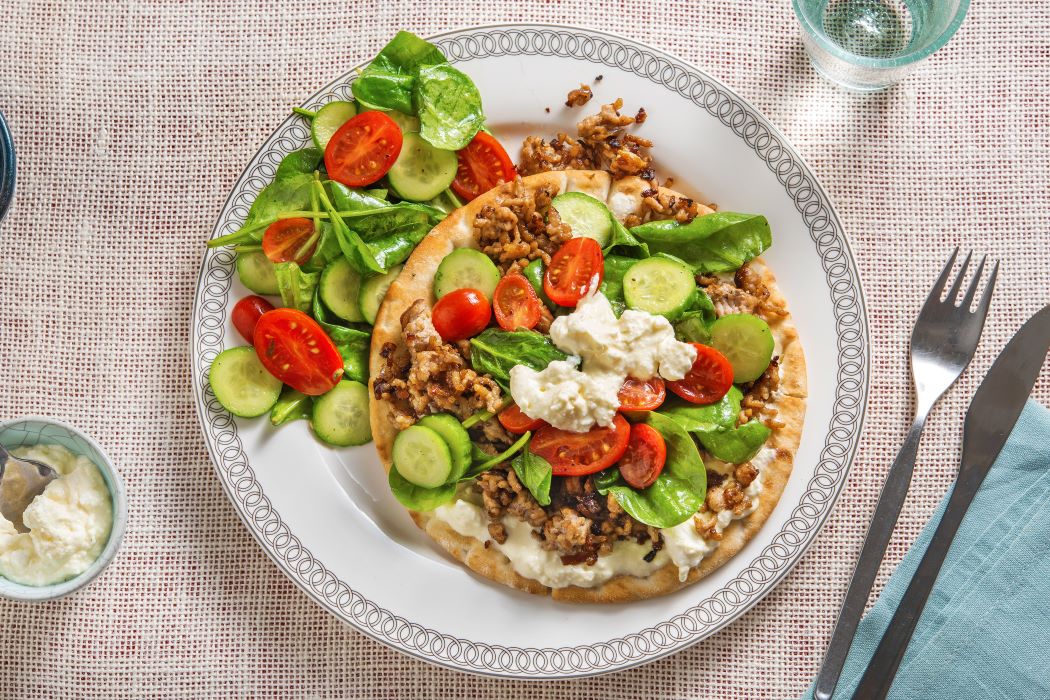 Pork Gyro Pitas with feta cream sauce and a chopped salad