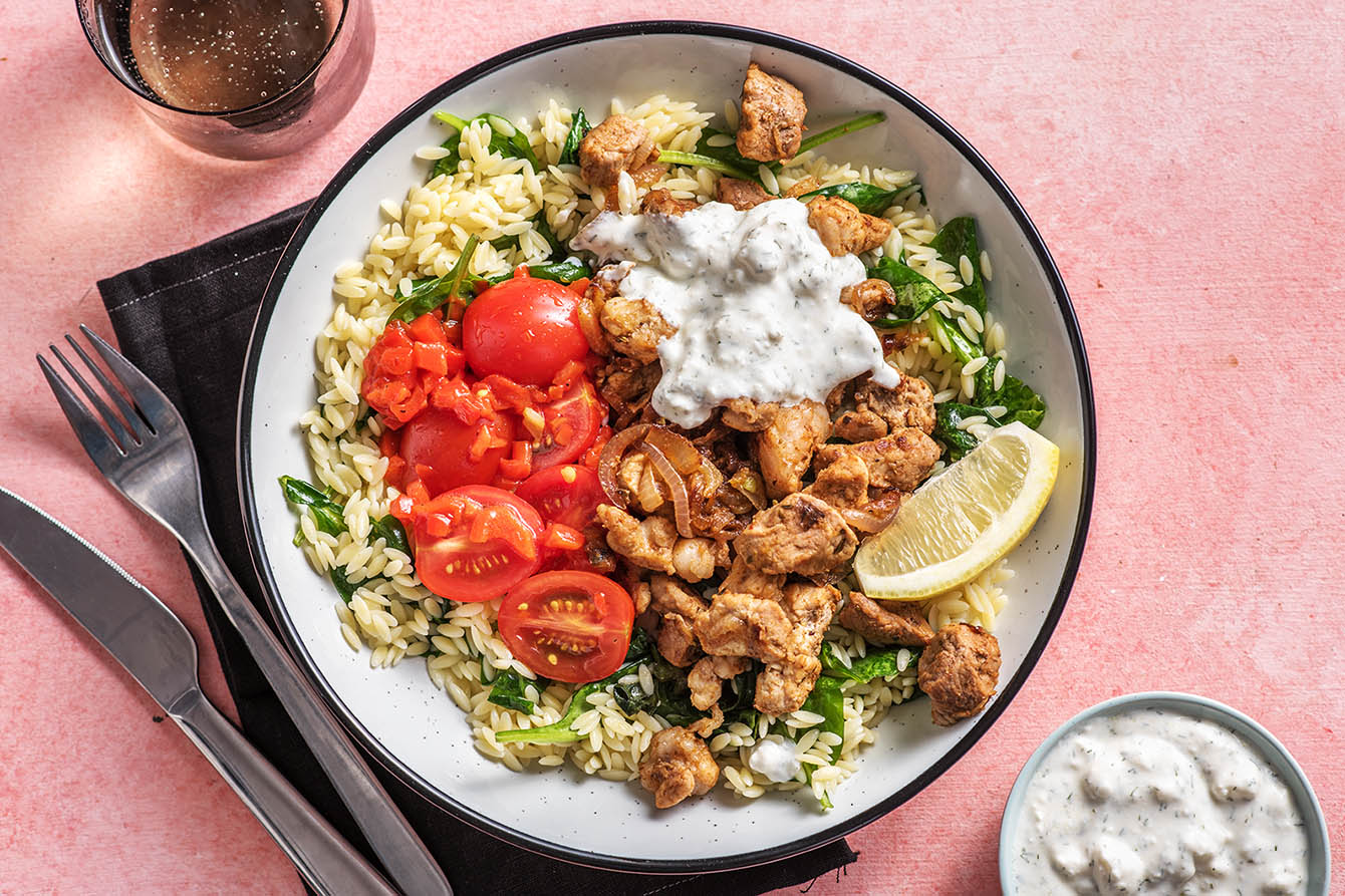 Pork Souvlaki Bowl with greek feta sauce and spinach orzo
