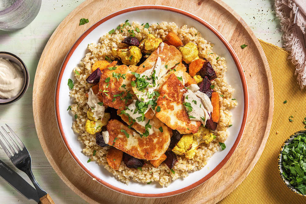 Cauliflower and Halloumi Grain Bowl over cracked wheat with garlic tahini sauce