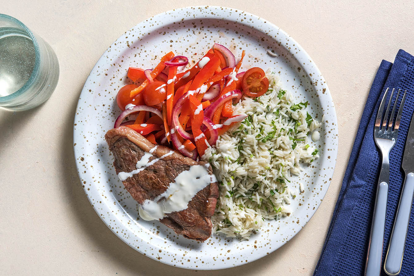 Spanish-Style Steak & Rice with charred peppers and garlic aioli