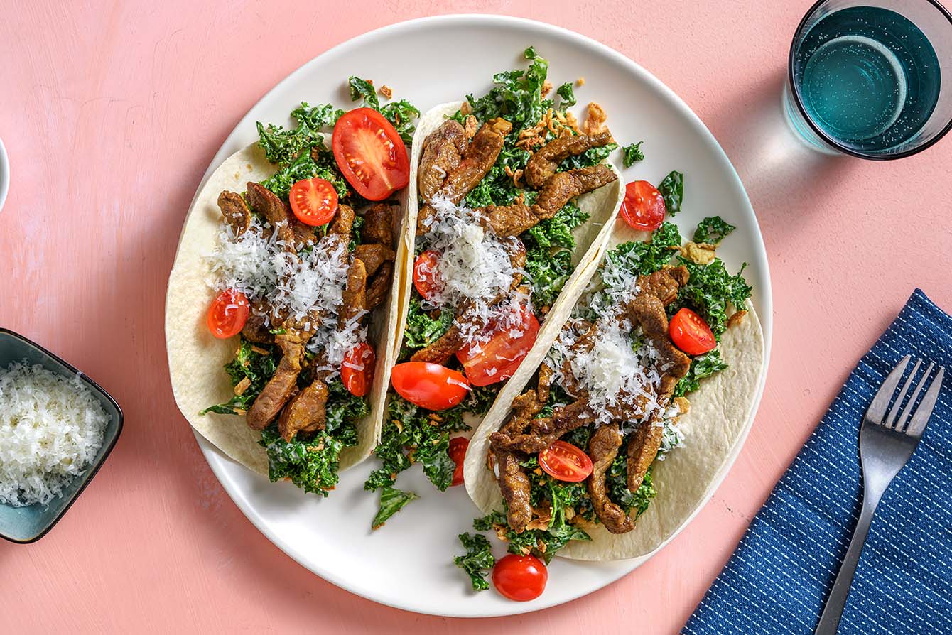 Steak Caesar Tacos with crispy shallots and parmesan cheese