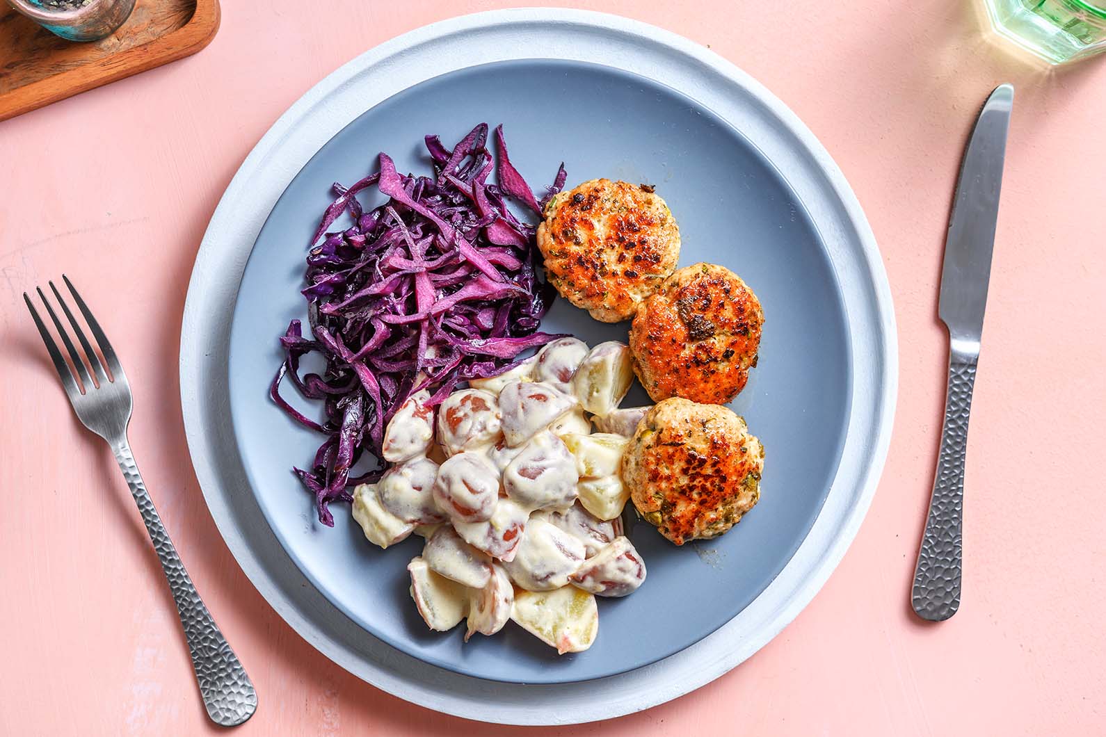 German-Style Turkey Patties with sautéed cabbage and potato salad